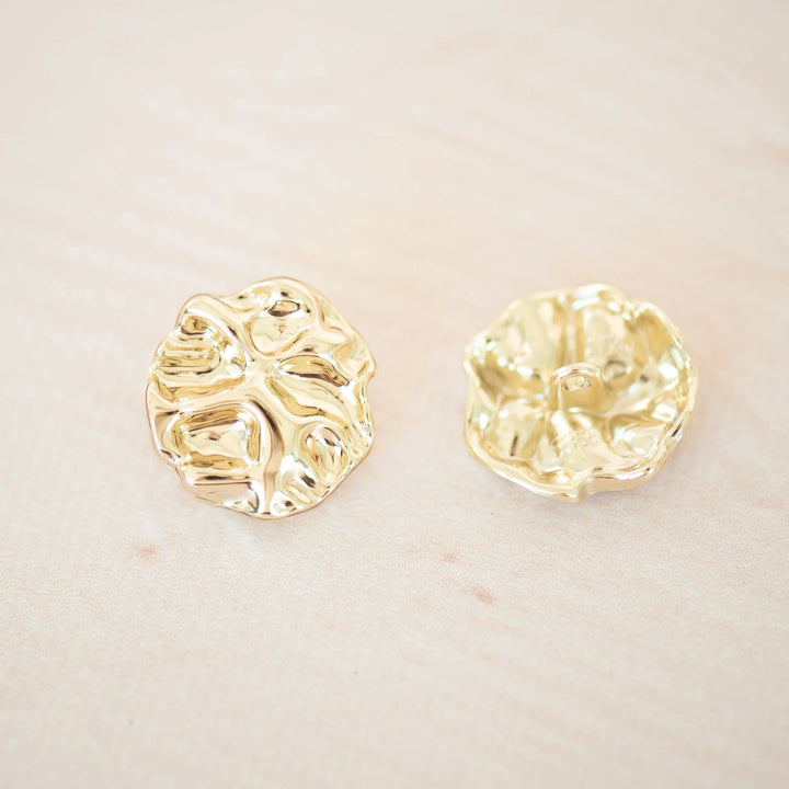 Moderni kultainen nappi